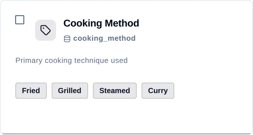 One attribute card: a checkbox, a tag icon, the name Cooking Method, the technical code cooking_method beneath it, the description, and four value chips — Fried, Grilled, Steamed, Curry